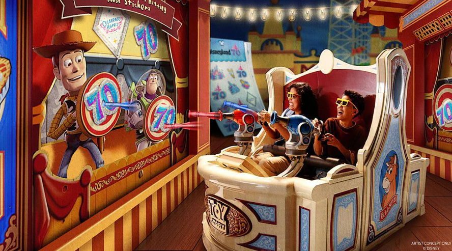 Two people on Toy Story Midway Mania shooting at the new 70 point targets.
