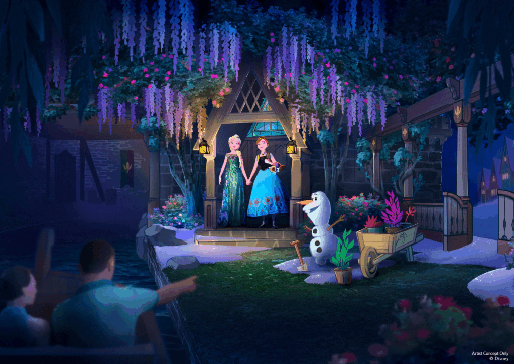 Anna and Elsa holding hands in a doorway surrounded by flowers with Olaf at World of Frozen, Disneyland Paris.